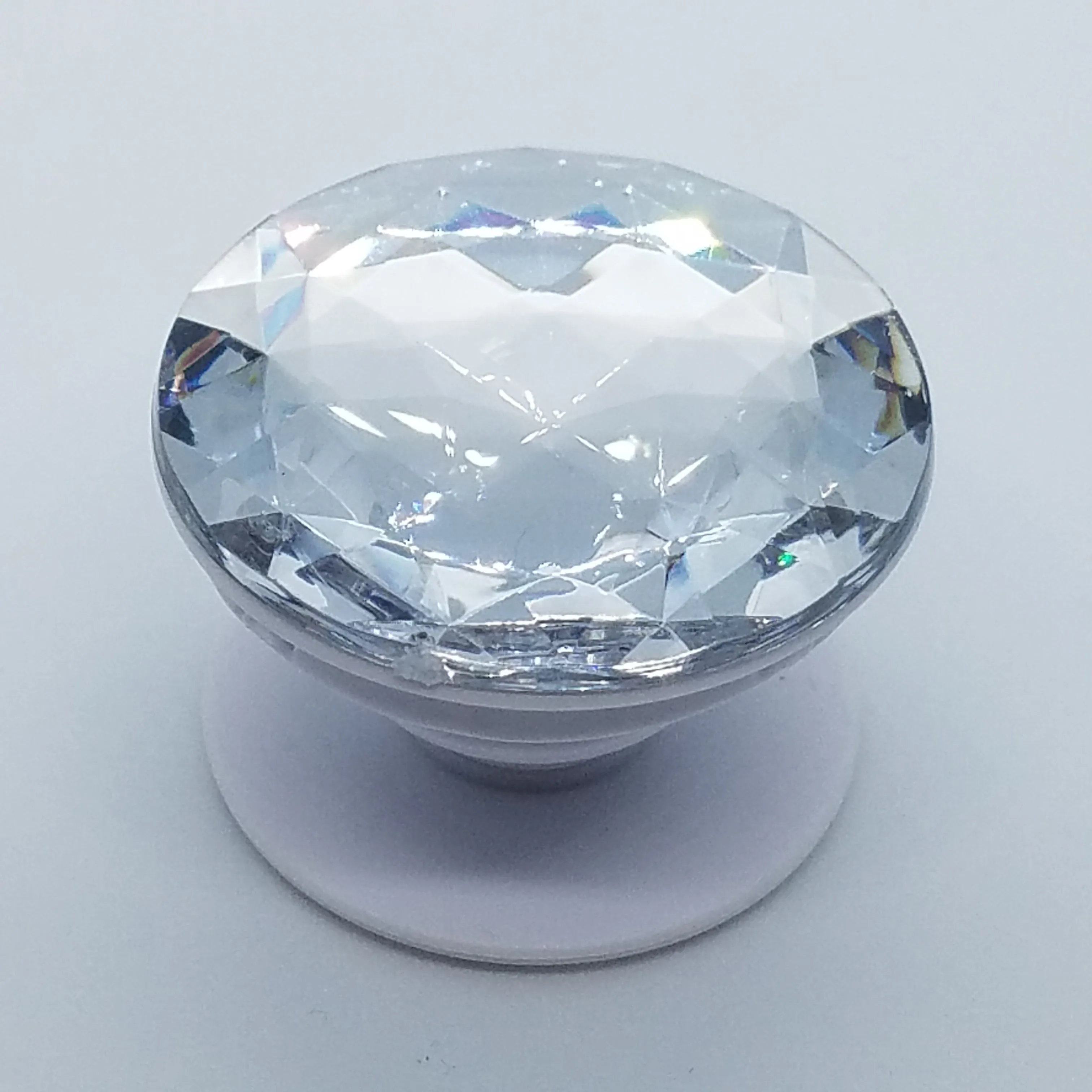 Plastic jewel pop up stand and grip